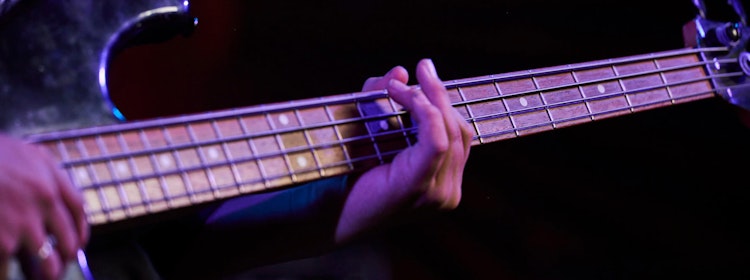 Kid learns to play bass at School of Rock Campbelltown