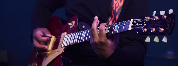 Kid learns to play guitar at School of Rock Campbelltown