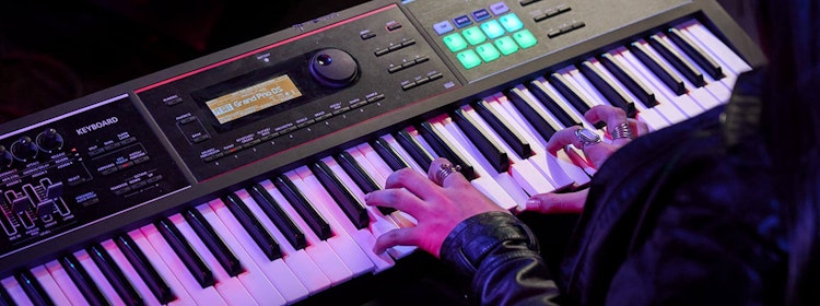 Kid learns to play piano at School of Rock Campbelltown