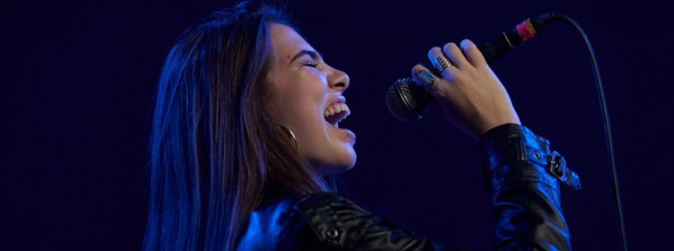 Kid learns to sing at School of Rock Campbelltown